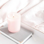 mindfulness practice for stress reduction with candle, notebook and soft blanket